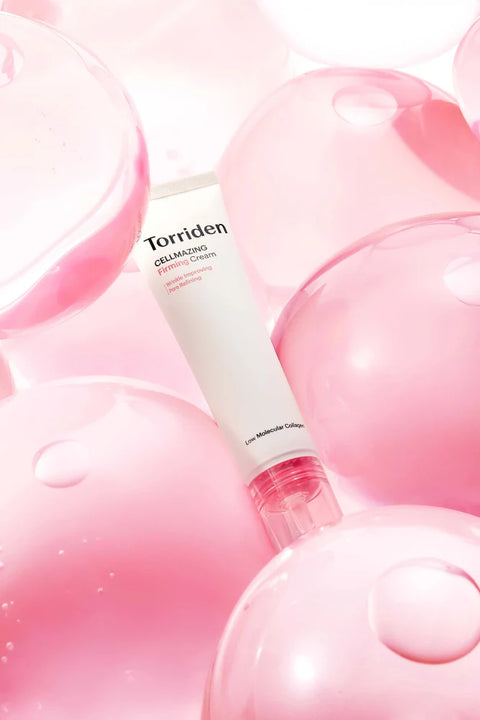 Torriden Cellmazing Firming Cream tube against pink bubbles